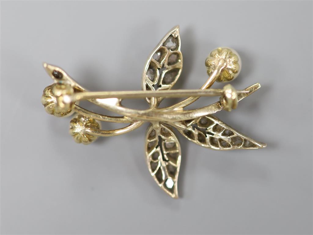 An early 20th century yellow and white metal, cultured pearl and rose cut diamond set floral spray brooch, 29mm, gross 4.2 grams.